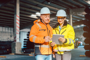 two construction workers discussing a project